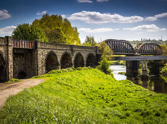 At its southern end, the structure comprises a plate girder bridge, four masonry arches and two spans over the River Calder.