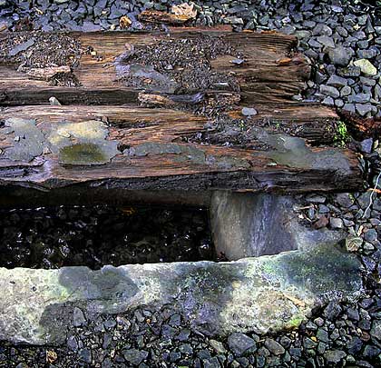 Catchpits provide access to the drain that runs below the centreline. Timbers still protect a few of them but most are now open.