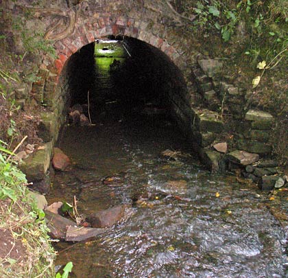 A neat culvert channels a watercourse under the trackbed.