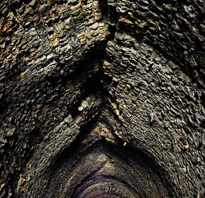 This is a tunnel under pressure. Surrounding earth movement has forced the crown of the arch upwards, resulting in significant distortion for about 30 yards.