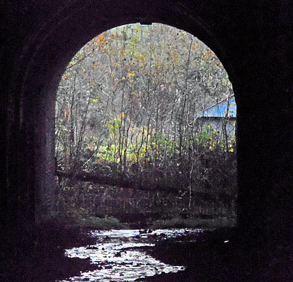 The single-track tunnel is now a conduit for water.