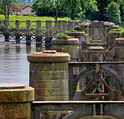 Looking in remarkably good condition, the original piers comprise pairs of stone columns braced together with ironwork.