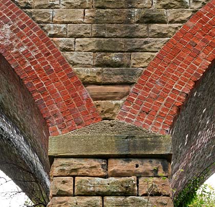 The elegant junction between arch, spandrel and pier.