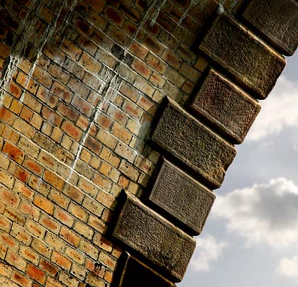 Arch soffits in brick contrast with the rock-faced, margined voussoirs.