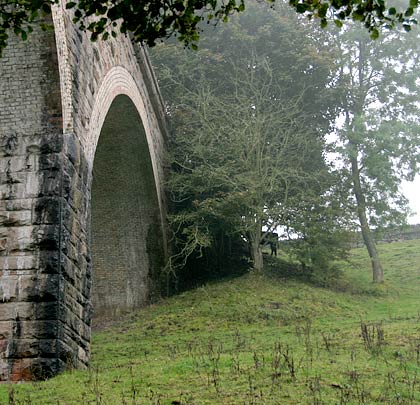 The masonry spandrels and piers contrast with the brick arch soffits.