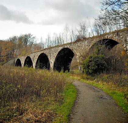 Comprising five low arches, Machen Viaduct served the Brecon & Merthyr Tydfil Junction Railway from 1885 to 1964.                                      Photo: Andy Gundy