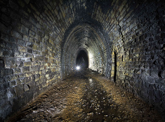 The tunnel has an acutely elliptical profile.