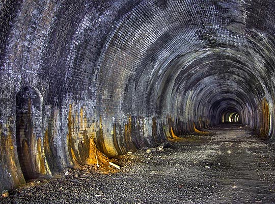 Although the tunnel is generally dry, there is some leaching of water through the lining at the crown.