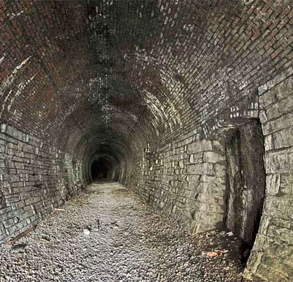 The tunnel is dry and incorporates a curve to the north.