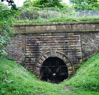 The line passed through a short tunnel, with a substantial stone portal, to access Tootle Heights Quarry.