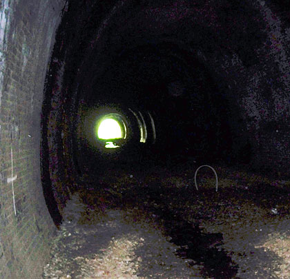 The view westwards showing standing water near the distant portal.