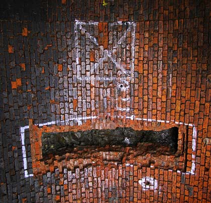 A slot was cut through the brickwork at the crown of the arch during trials for a void grouting technique in 1990.