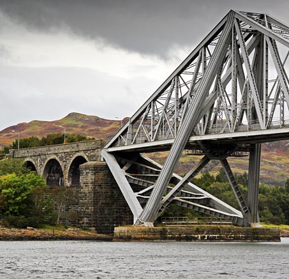 The bridge was designed by Sir John Wolfe Barry and built by Arrol's Bridge & Roof Company for the Callander & Oban Railway.