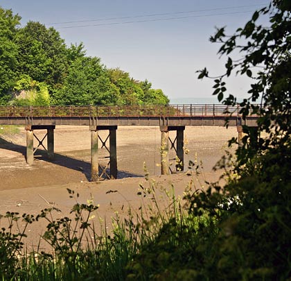 The tidal channel must have created substantial challenges during construction of the bridge.