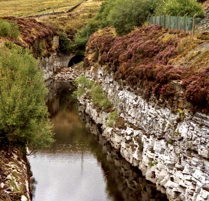 A mid-eighties view towards Queensbury Tunnel's southern portal from the aqueduct over the wonderful Strines cutting.