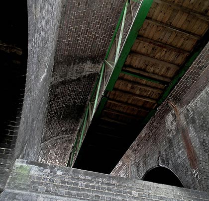 Another structure intersects with the tunnel at roof level, accomodating a walkway used by workers at the local gas works.