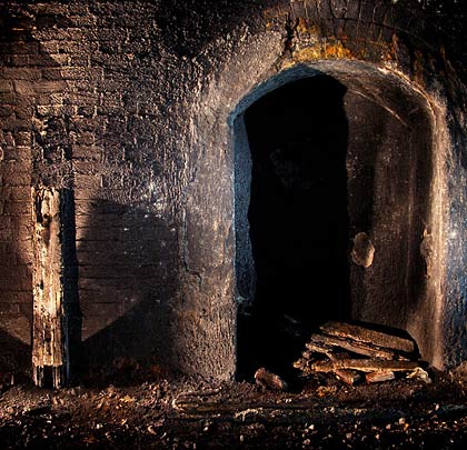 Four pieces of bullhead rail sit against the east wall. Did they formerly act as mileposts?