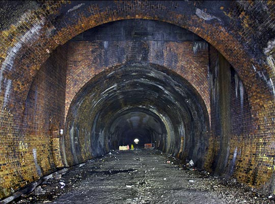 At the midpoint of the tunnel is a lone shaft, rectangular in plan, but there is no evidence that this was ever open for ventilation purposes.