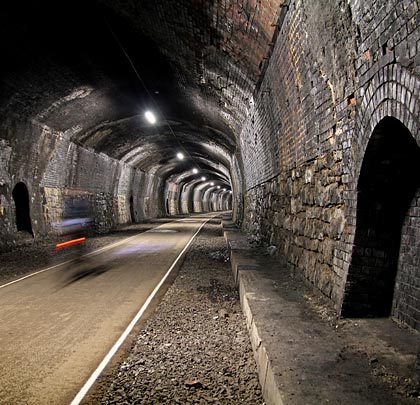 The tunnel follows an S-shaped alignment; the line climbing towards Millers Dale on a gradient of 1:100.