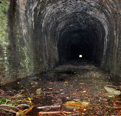 The southern end of the tunnel appears less wet than the other.