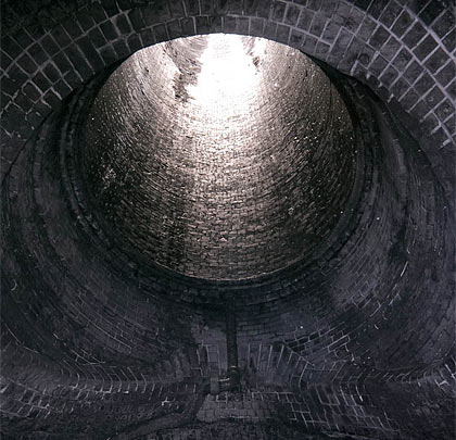 The complex brickwork at the base of its shaft.