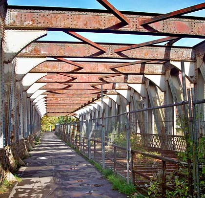 With the railway fenced off, a footpath now crosses the structure.