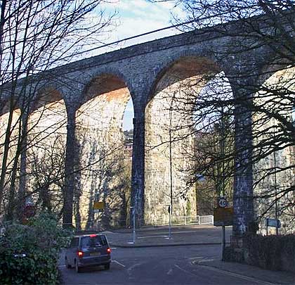 Roads pass beneath three arches; one used to pass over a railway.