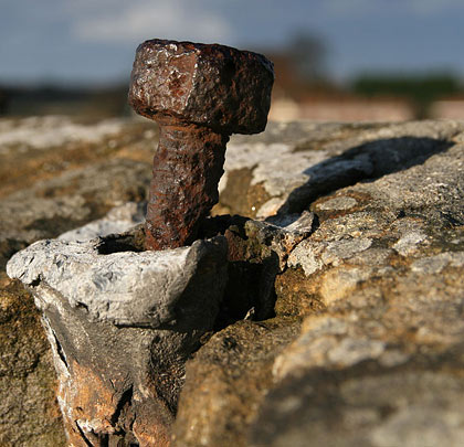 On deck, a securing bolt clings to the parapet wall.
