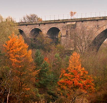 At the viaduct's northern end, a stepped buttress separates the three minor arches from the main spans.