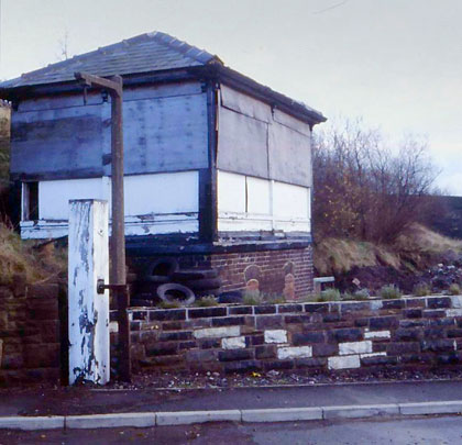 Boarded up - the old signal box, across the road from the station.