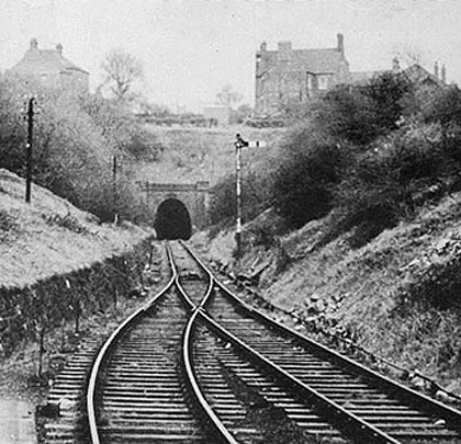 The single track resumes as the line enters the northern approach cutting to the 307-yard Woodville Tunnel.