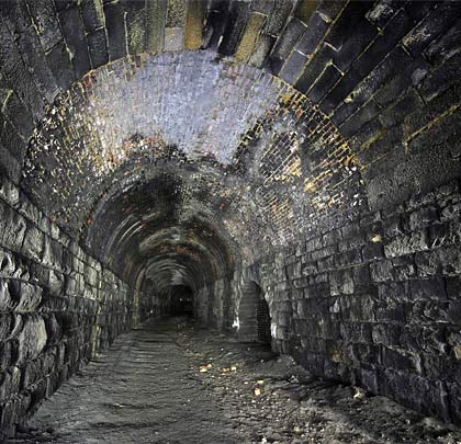 The southern half of the tunnel has a masonry arch, the junction being located adjacent to the adit.