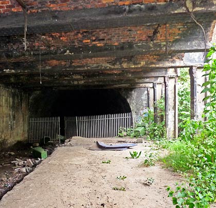 The tunnel emerges at the former site of Bridgeton Cross Station.