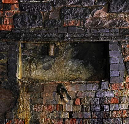 Near the middle of the tunnel, a 'window' is cut into the east sidewall for purposes unknown.