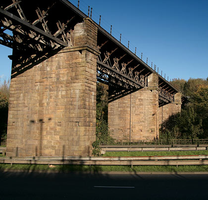 Lit by summer sunshine, the viaduct spans the A666 into Bolton.