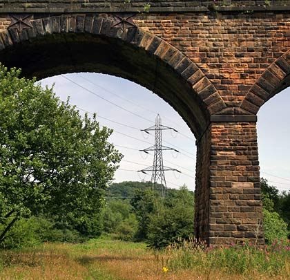 The viaduct crosses former industrial land, once occupied by a Bolton Corporation sewage farm and bleach works.