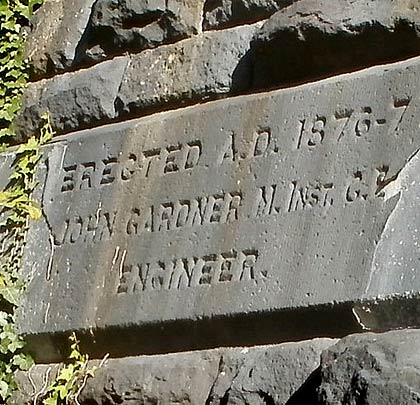Enjoying the sunshine, a stone tablet on the viaduct's south side records the role of John Gardner, its engineer.