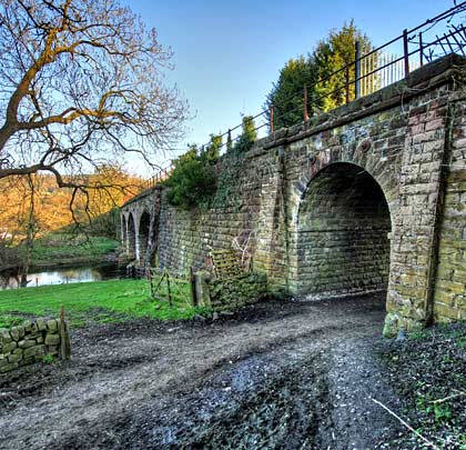West of the embankment is Duke's Bridge, carrying the railway over a track that leads to the Chatsworth Estate.