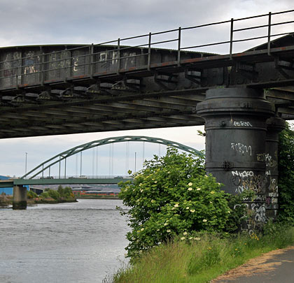 Old and newish: alongside the railway crossing is the 1967 road bridge.