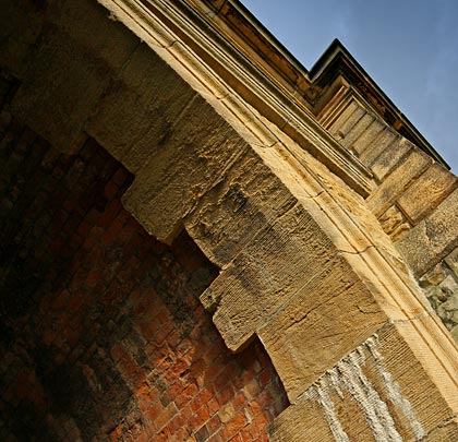 Access along the river banks is provided by arches cut through the masonry abutments.
