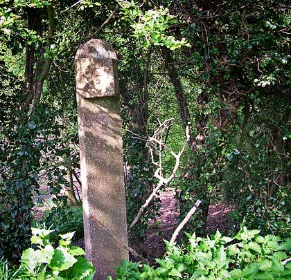 A concrete milepost marks the way near Shepshed.
