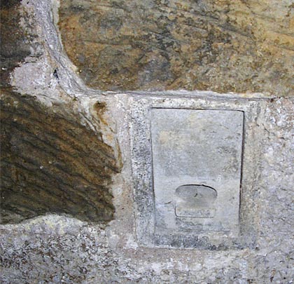 A bat box has been inserted into the stonework.
