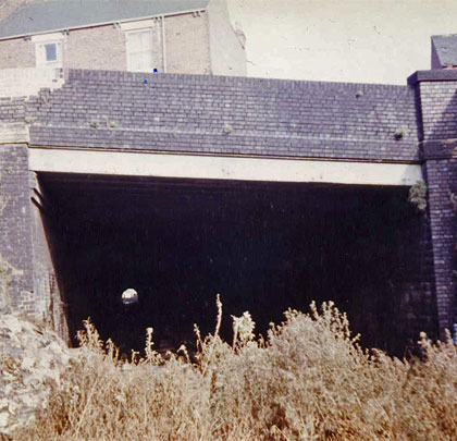 The tunnel's original south portal took the form of a bridge which carried Hollis Lane over the railway.