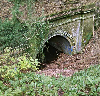 Similar in design, the east portal now looks out at a slope of landfill.