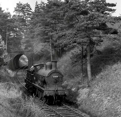 On 11th April 1954, locomotive 31064 heads towards St Michaels Halt.