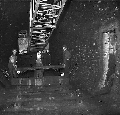 A crane was squeezed into the tunnel to lift the sleepers.