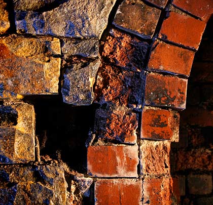 Stone meets brick, and spalling occurs.