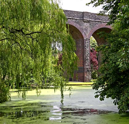 Topped by a refuge, one of the piers reflects in a water feature.