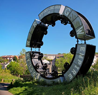 At the east end of the viaduct is the 'Wheel o Drams' - a sculpture by Andy Hazell, formed from six coal mining 'dram' wagons that commemorates the local industrial heritage.