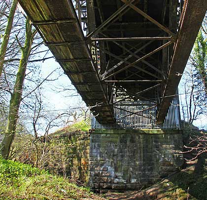 The southern abutment, now bedecked in palisade fencing, is immediately next to Millheugh Road.